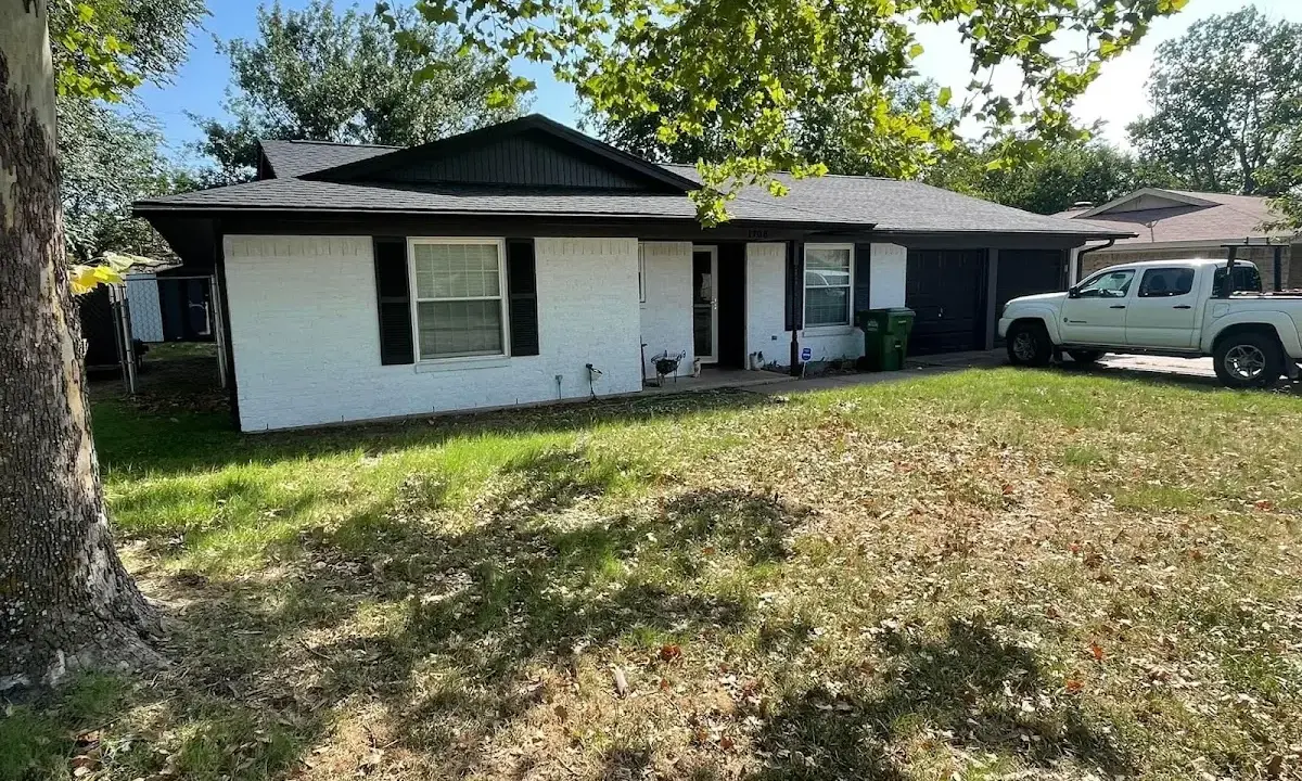 Professional roofing crew working on a residential roof in Stillwater